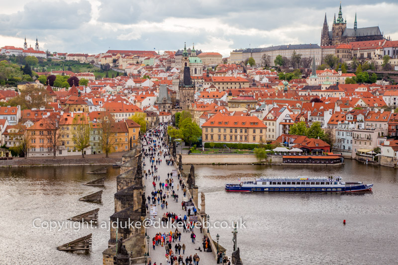 The Charles Bridge crossing the Vltava river and the St Vitus cathedral in Prague, Czech Republic