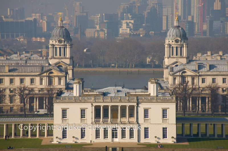 Queens house, old Royal Naval College, now part of the University of Greenwich, river Thames and docklands seen from Greenwich Park, London