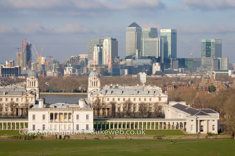 Queens house, old Royal Naval College and docklands seen from Greenwich Park, London