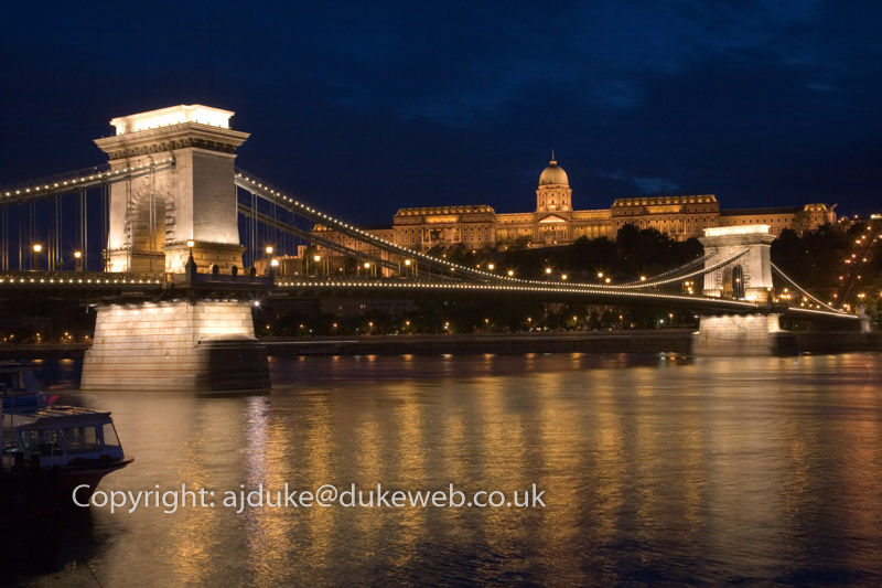 Chain Bridge over the Danube river and Royal Palace on Castle Hill at night, Budapest